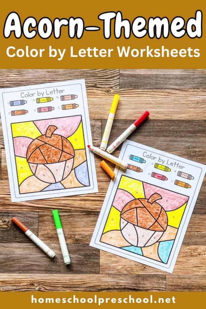 Two acorn-themed color by letter worksheets on wood surface. Each has a large acorn shape divided by letters with a color key on top.