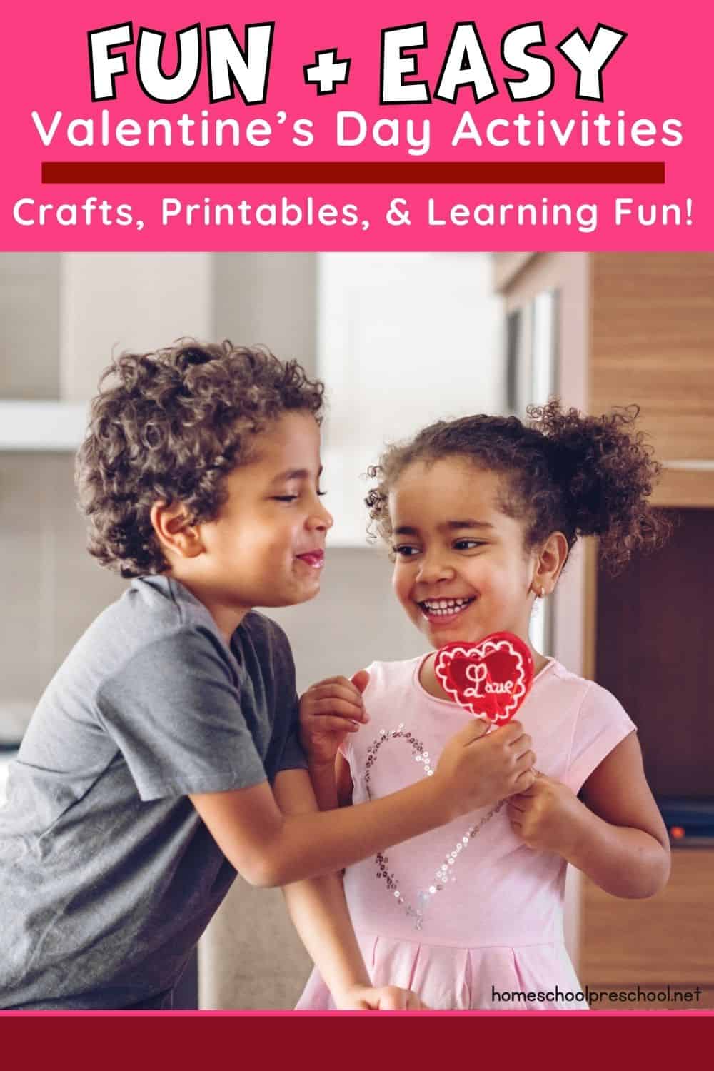 Two happy preschoolers exchanging a heart-shaped Valentine’s treat in a cozy home setting.