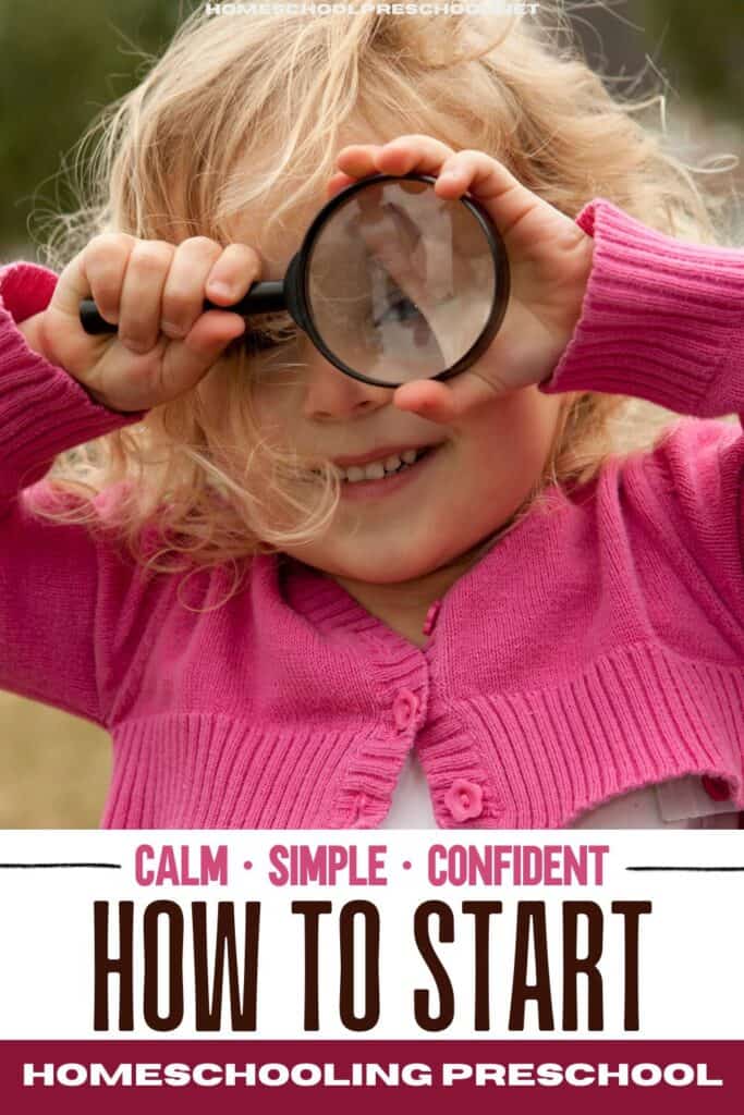 A young child wearing a pink sweater looks through a magnifying glass outdoors, smiling — image for a blog post titled “How to Start Homeschooling Preschool” about creating a calm, simple, and confident homeschool rhythm.
